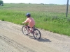 Mason riding near farm